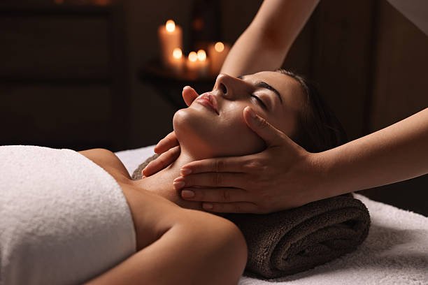 attractive woman enjoying face massage, closeup. beauty procedure